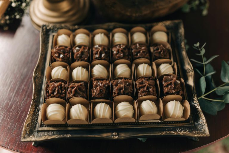 Beautiful gourmet chocolate confections on a vintage tray, perfect for dessert presentations.