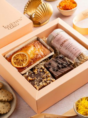 Elegant gift box with baked goods and sweets, perfect for celebrations and gifting.