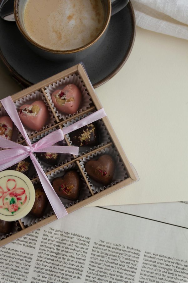 Indulge in a gourmet chocolate box paired with a latte, perfect for gifting or special occasions.