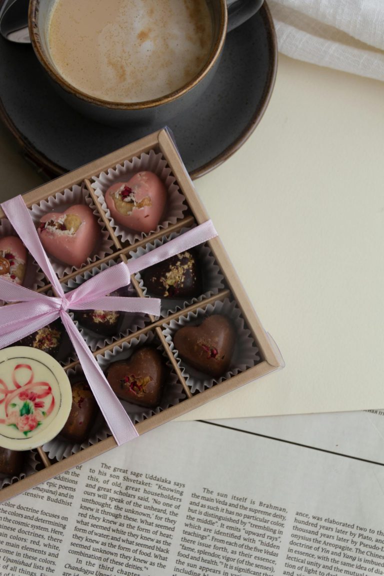 Indulge in a gourmet chocolate box paired with a latte, perfect for gifting or special occasions.